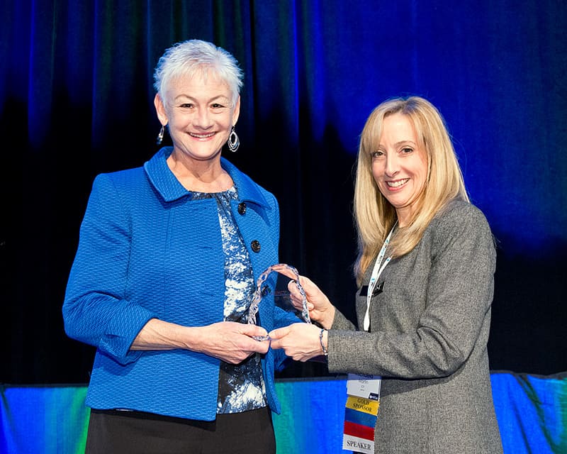 Mary Templeton receives an award from the Midwest Energy Efficiency Alliannce