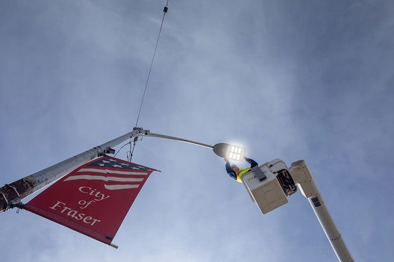 Electrician working on an LED street light in the city of Fraser, Michigan