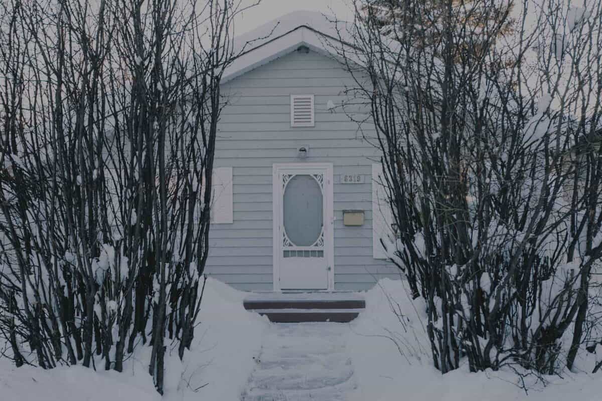 Older home in winter time with snow every where