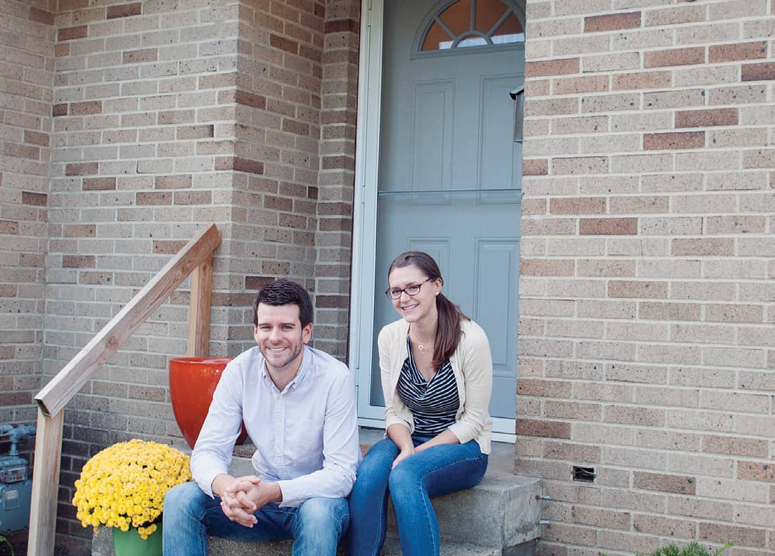 Brian and Sara Catlett on their front porch